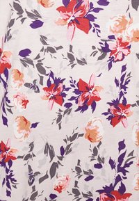 Floral fabric featuring pink, red, orange, and purple flowers on a light background, with green leaves and a soft, textured appearance.