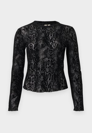 Haut à manches longues noir et gris avec motif imprimé serpent et encolure ronde, silhouette ajustée sur fond blanc.