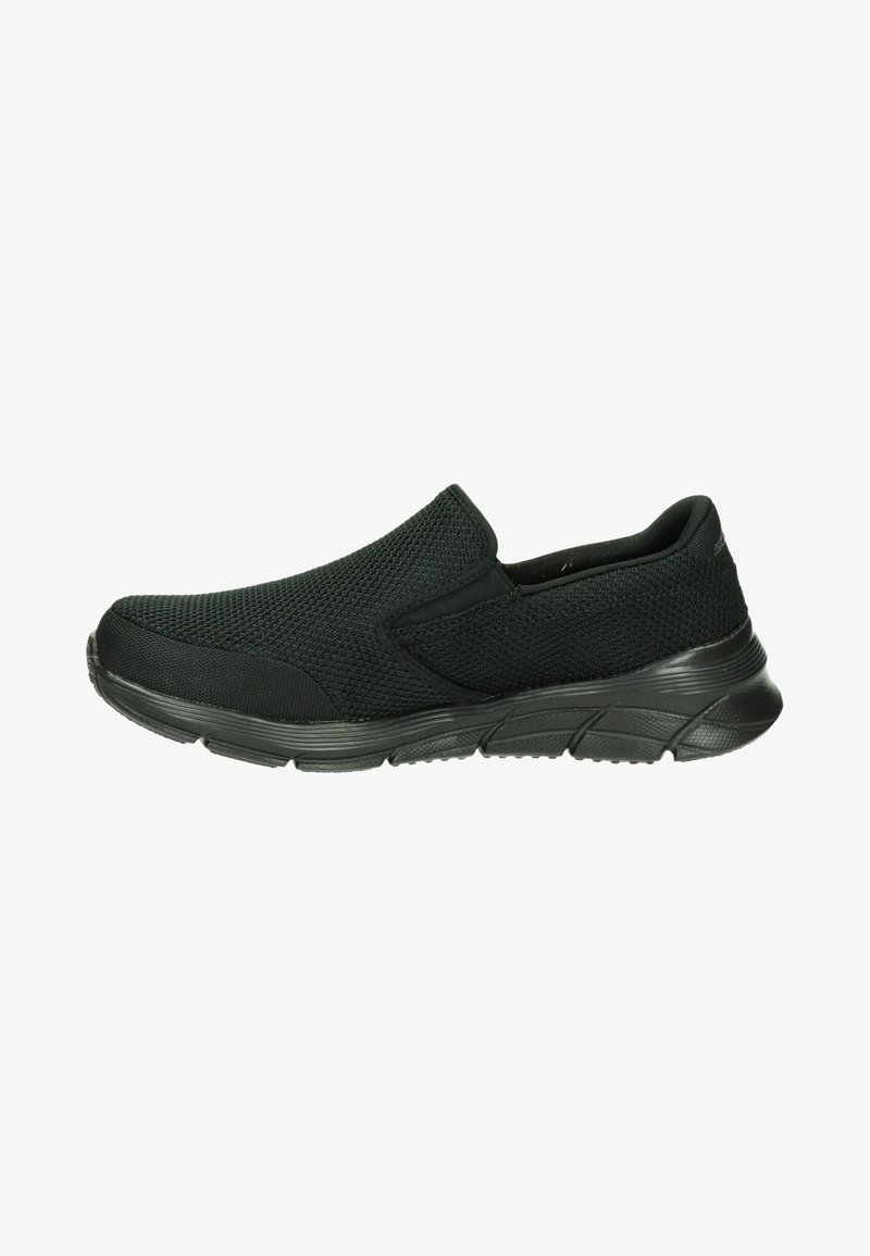 Black slip-on shoes with a textured mesh upper and a flexible rubber sole, viewed from the side against a white background.