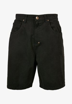 Mustad mustreeritud mustad puuvillased lühikesed püksid, millel on elastne vöökoht, kaks esipoolset taskut ja ühe nupu sulgur. Omab tekstuurset kangast ja minimaalset detailimist.