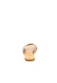 Tan sandal with thin straps and a cushioned footbed. Smooth texture, minimalist design, and a small logo on the sole.