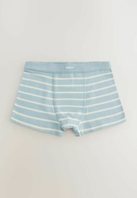 Blå och vita randiga herrboxershorts med en mjuk elastisk midjeband märkt "NEXT", med en klippning vid mitten av låret och en åtsittande design.