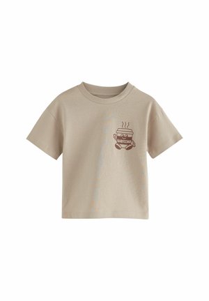 Beige kurzärmeliges T-Shirt aus Baumwolle, mit einem braunen Grafik eines lächelnden Getränkebechers mit Dampf und dem Schriftzug "BABYCINO."