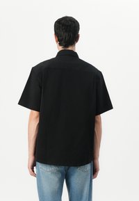 Calvin Klein Jeans UTILITY RELAXED SHIRT - Button down-skjorte - black