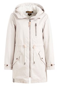 Giacca impermeabile beige chiaro con cappuccio regolabile, chiusura frontale con zip, due tasche laterali e vita elastica. Presenta una zip e dei lacci in contrasto.