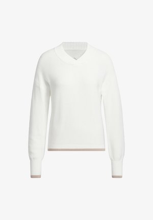 Bijela pletiva majica s V-izrezom, rebrastim ovratnikom i manžetama. Ima kontrastnu bež prugu na rubu. Lagana tekstura.