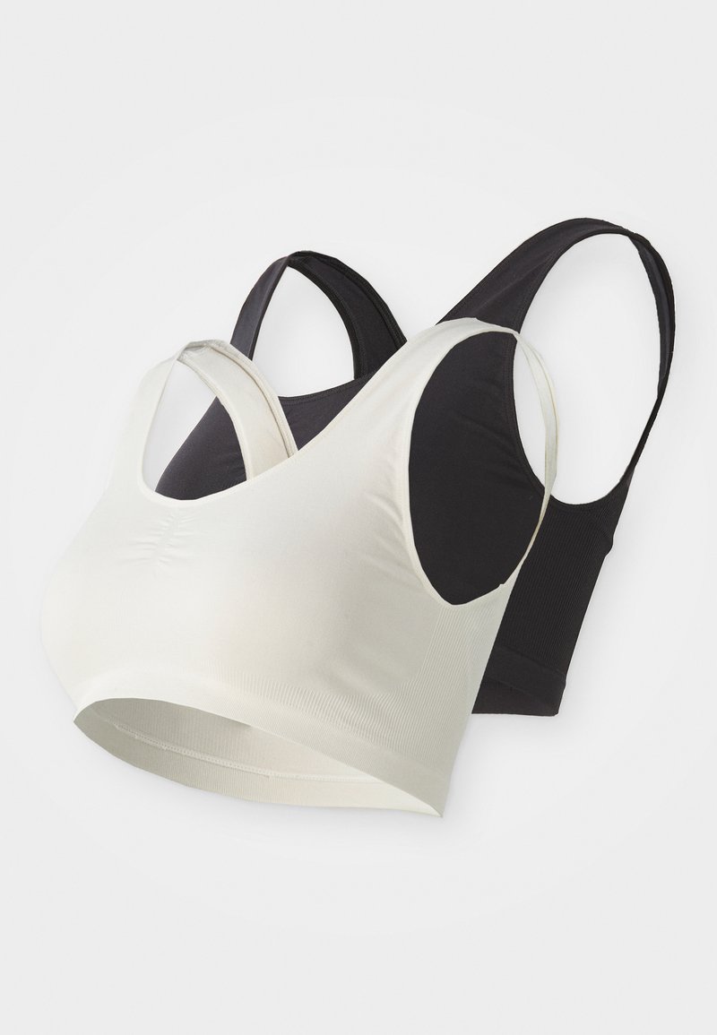 Divi bezšuvju krūšturi melnā un krēmkrāsā, kas izgatavoti no mīkstas un elastīgas drānas, ar platām siksnām un apaļu izgriezumu bez kauliem.