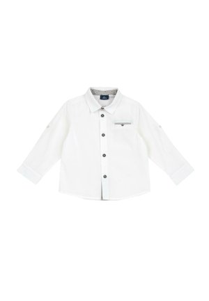Biała koszulka dla małego dziecka z długim rękawem, czarnymi guzikami, małą kieszonką na piersi z guzikiem oraz klasycznym kołnierzykiem.