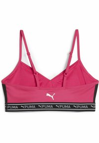 Sujetador deportivo PUMA en un vibrante color rosa, con tirantes ajustables, diseño en forma de v y una banda elástica negra que presenta texto del logo en blanco.