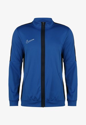 Blue Nike track jacket with a high collar, zip front, black side panels, and zippered pockets. Made of smooth, lightweight fabric.
