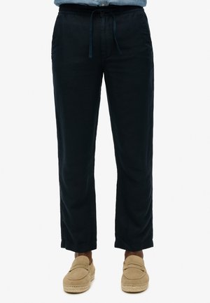 Pantaloni in lino leggeri di colore blu navy, con vita elastica e cordoncino. Design a gamba dritta, con tasche laterali e texture morbida.