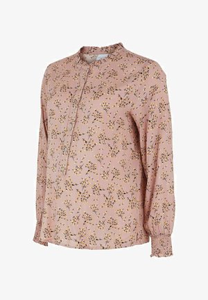 Vaaleanpunainen pitkähihoinen pusero, jossa on keltavalkoinen kukkakuvio, napillinen etulista, röyhelökaulus ja resorikähärät hihoissa.