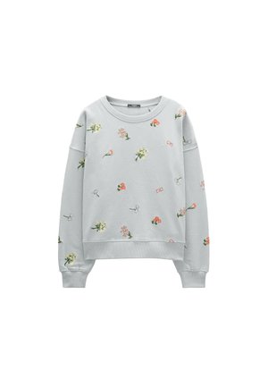 Jasnoszara bluza z długim rękawem z prążkowymi mankietami, ozdobiona rozproszonymi małymi kwiatowymi i motyli nadrukami w pastelowych kolorach.