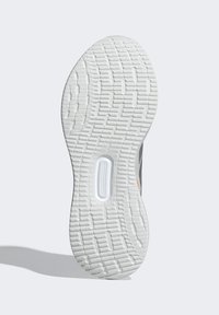 Schuhsohle mit einer strukturierten weißen Gummi-Außensohle, einem gemusterten Profil und einem sichtbaren Logo. Graue seitliche Akzente sind ebenfalls vorhanden.