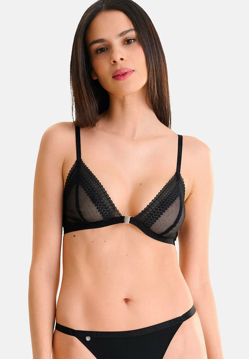 Soutien-gorge triangle en dentelle noire avec des panneaux transparents et une fermeture avant métallique. Agrémenté de délicates bordures et de fines bretelles ajustables.