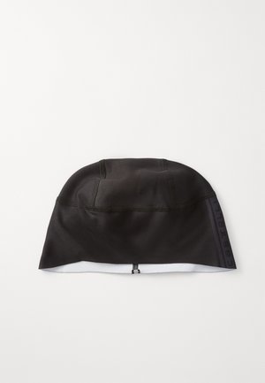 Black cycling cap made of stretch fabric with a smooth texture. Features a zip at the back and contrasting brand logo on the side.