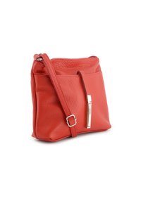 Red leather crossbody bag with a textured finish, featuring a front pocket, adjustable strap, and silver hardware accent.