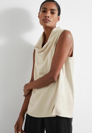 Beige draperad sleeveless toppi, jossa on kauluskotelo, pehmeä kangas, sivureiät ja rento istuvuus.