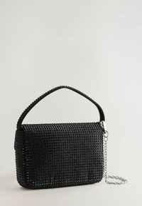 Black rectangular handbag covered with black studs, featuring a short studded handle and a silver chain strap against a light background.