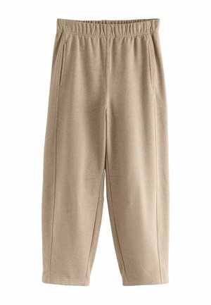 Beige Jogginghose mit elastischem Bund, Seitentaschen und lockerer Passform; aus weichem Stoff mit glatter Textur.