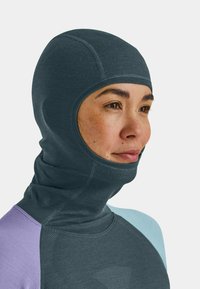 Dark gray balaclava made of soft material, featuring a close-fitting design with contrast color accents in light blue and lavender.