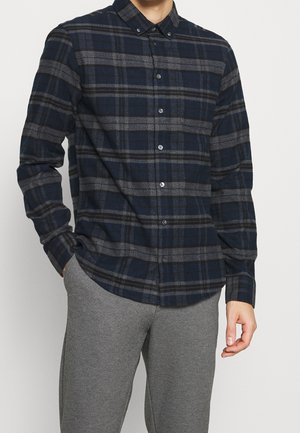 Camicia a quadri navy e grigia, realizzata in tessuto flanella, con colletto, maniche lunghe e vestibilità aderente, dotata di chiusura frontale con bottoni.