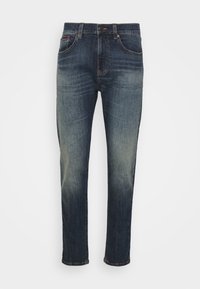 Schmale blaue Denim-Jeans mit verwittertem Wasch-Effekt an Oberschenkeln und Knien, mit vorderem Knopfverschluss und fünf Taschen Design.