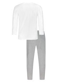 Top bianco a maniche lunghe con scollatura rotonda. Leggings grigi con un design aderente. Entrambi realizzati in tessuto morbido e leggero.