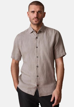 Leinenhemd mit kurzen Ärmeln in hellem Beige mit strukturierter Oberfläche, versehen mit durchgehendem Knopfverschluss und kleinen dunklen Knöpfen.