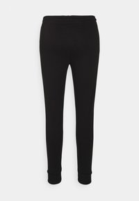 Černé slim-fit jogger kalhoty s elastickým pasem a úzkými kotníky, vystavené na bílém pozadí.