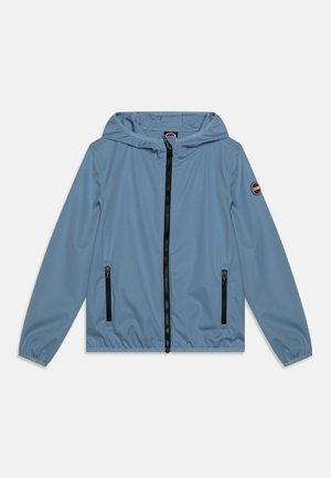 Light blue hooded jacket with zip front, elastic cuffs, and two black zippered pockets. Features a circular logo on the left sleeve.
