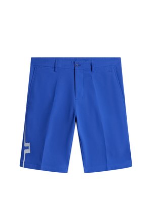Shorts bleus avec un design à l'avant plat, dotés de poches latérales et d'un motif géométrique blanc contrastant sur la jambe gauche.