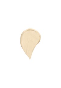 Échantillon de crème beige avec une texture lisse et épaisse en forme arrondie, présentant une finition mate uniforme sur fond blanc.