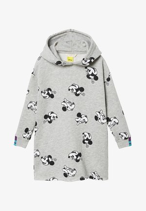 Robe grise à capuche et manches longues, présentant des illustrations répétées du visage de Minnie Mouse en noir et blanc et de petites rayures colorées sur les poignets.