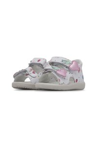 Witte sandalen met bloemmotieven, roze hartaccenten en verstelbare bandjes. Open teenontwerp met een flexibele rubberen zool.