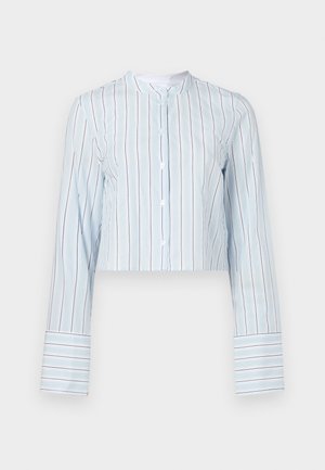 Cropped long-sleeve shirt in light blue with vertical stripes. Features a round collar and white buttons along the front. Striped cuffs.