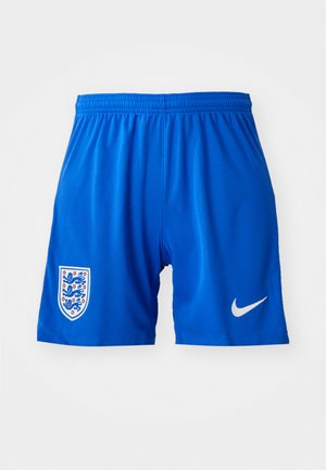 Kék sportnadrág texturált anyagból, rugalmas derékpánttal, fehér Nike logóval és az angol válogatott címerével a bal oldalon.