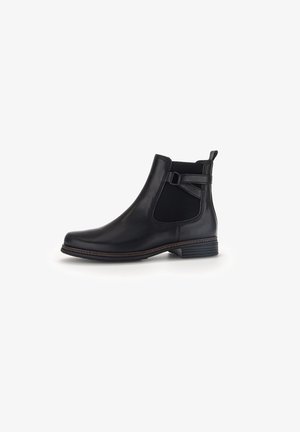 Bottines en cuir noir avec des panneaux élastiques sur les côtés, une sangle décorative et un petit talon. Surface lisse avec un contour cousu marron.