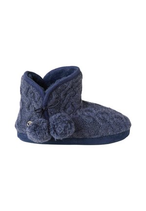 Botín de pantufla tejido suave en azul marino con pompones, forro de forro polar acogedor y suela plana para uso en interiores.