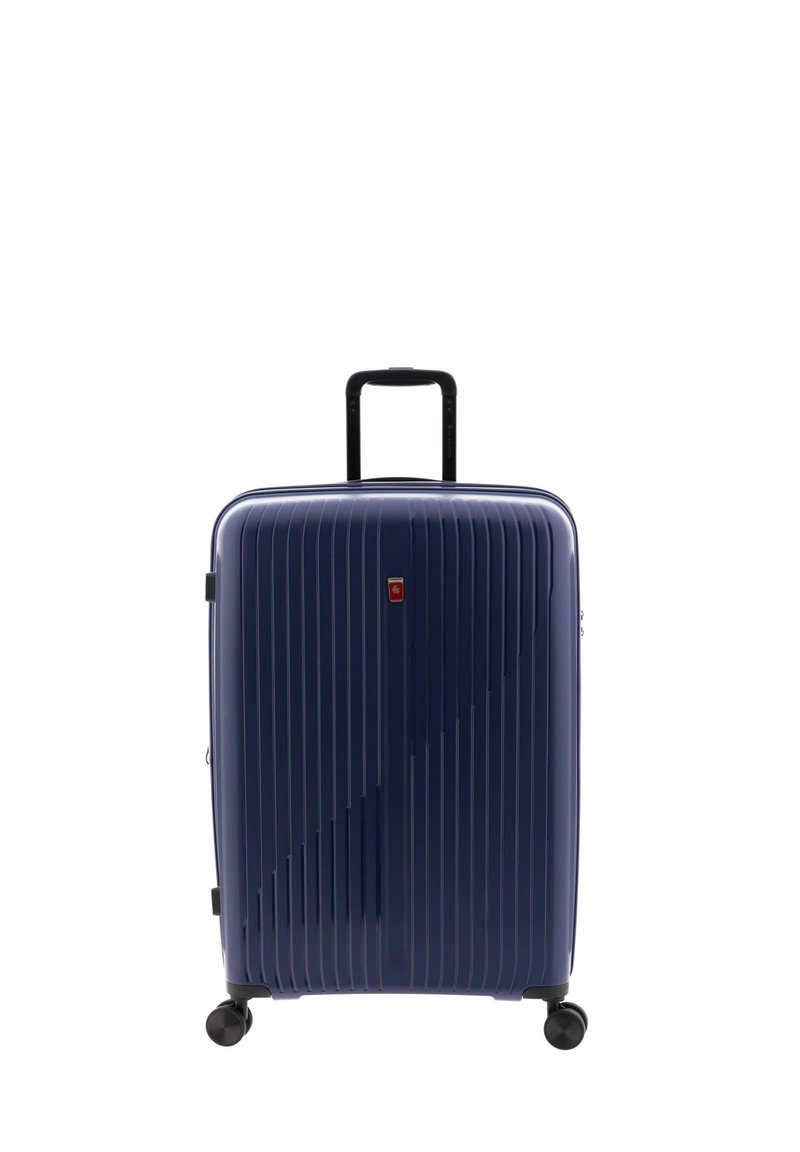 Valigia rigida blu navy con scanalature verticali, manico estraibile e quattro ruote nere per una facile mobilità. Presenta un piccolo logo sul davanti.