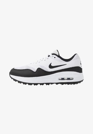 Deportiva Nike Air Max en blanco y negro con parte superior de malla, cojín de aire visible en la suela y logo negro de swoosh en el lateral sobre fondo blanco.