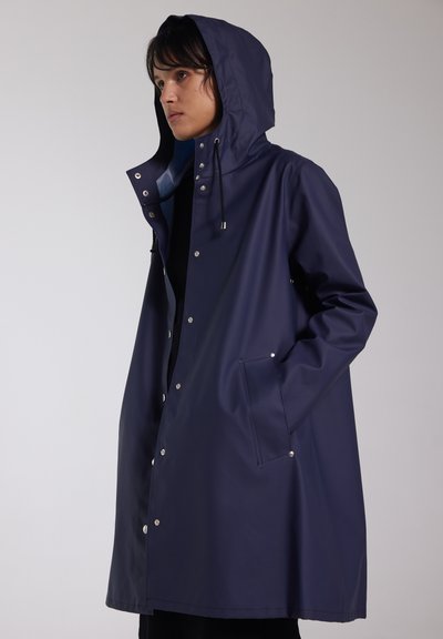 Navy raincoat with hood, made of smooth waterproof material. Features snap buttons, a front pocket, and drawstring for adjustable fit.