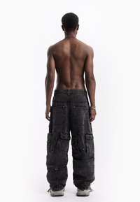 FAVELA MULTI POCKET UNISEX - Relaxed fit jeans - black