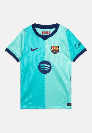 Maillot de football bleu clair du FC Barcelone avec col bleu foncé, écusson du club sur la poitrine, logo Nike et logo du sponsor Spotify au centre.