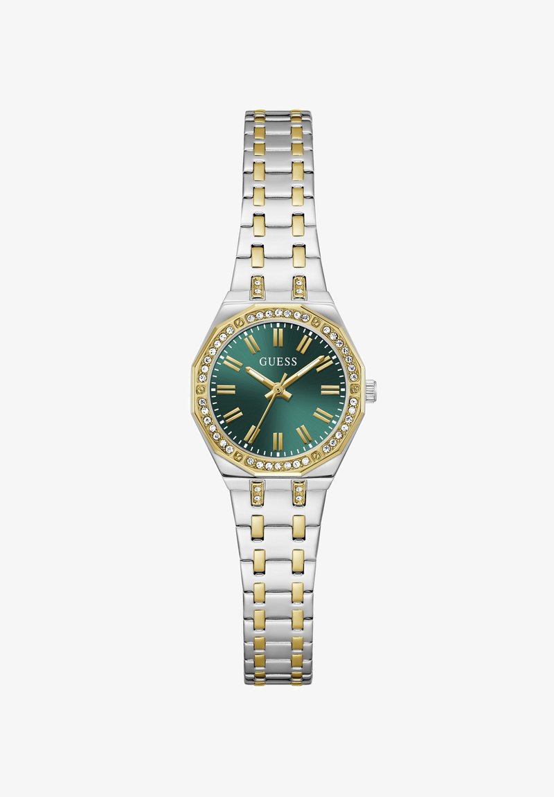 Δίχρωμο μεταλλικό ρολόι χειρός με πράσινο καντράν, χρυσούς ρωμαϊκούς αριθμούς, στεφάνη διακοσμημένη με κρύσταλλα και βραχιόλι με συνδεδεμένους κρίκους.