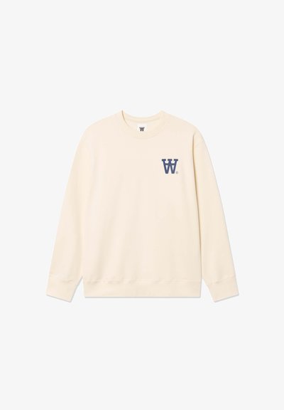 Sweat-shirt beige clair avec un col rond, des manches longues, des poignets côtelés, et un logo "W" bleu foncé sur la poitrine gauche. Texture lisse.