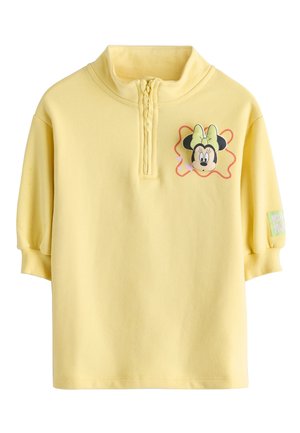 Gelber Kinder-Sweatshirt mit halbem Reißverschluss vorne, Minnie-Maus-Gesichtsgrafik und Schleife auf der Brust sowie gerippten Bündchen an den kurzen Ärmeln.