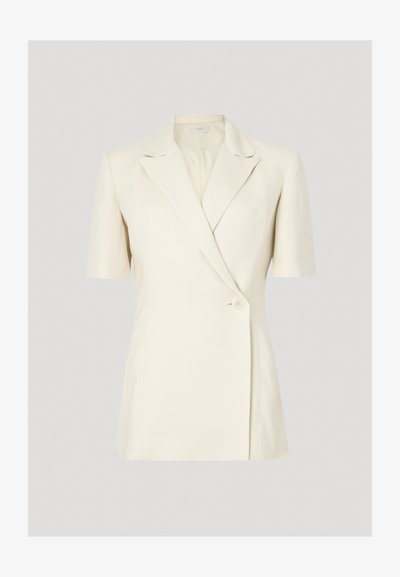 Short-sleeve blazer in cream, featuring a notched collar, double-breasted design, and a single button closure. Smooth, tailored fabric.