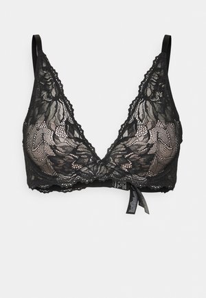 Zwarte kanten bralette met golvende randen, driehoekige cups, verstelbare banden en een centrale strikdetail. Doorzichtig materiaal en bloemmotief.