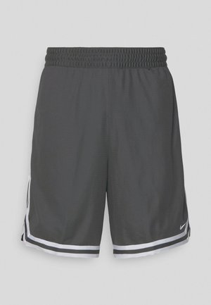 Svarta träningsshorts i nätmaterial, med elastisk midja, vita randiga accenter och sidoslitsar för rörlighet. Nike-logotyp finns.